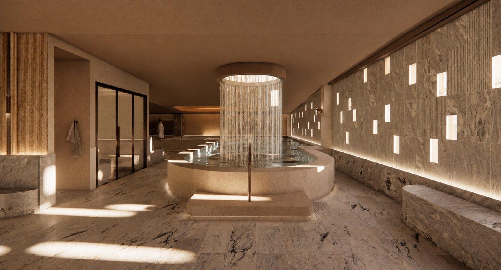 The wellness pools, a rain curtain falling from a bronze ceiling ring